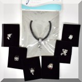 J179b. Infiniti charm bracelet with 6 extra charms. (Frog, dolphin, fish, rose, box and sheashell.) - $$16 each 